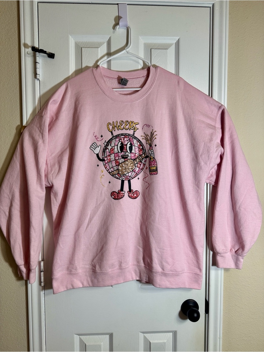 Pink Sweatshirt with Cheerful Globe Graphic